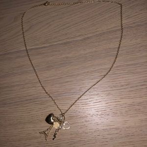 Dangly gold necklace with charms